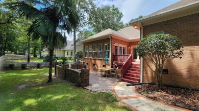 Discover this beautifully crafted 4-bedroom, all-brick home in on Landings Golf Club in Georgia - for sale on GolfHomes.com, golf home, golf lot