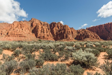 Set along the backdrop of bubbling creek, and beautiful fountain on Entrada at Snow Canyon in Utah - for sale on GolfHomes.com, golf home, golf lot