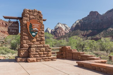 Set along the backdrop of bubbling creek, and beautiful fountain on Entrada at Snow Canyon in Utah - for sale on GolfHomes.com, golf home, golf lot