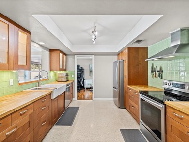 Tucked into one of Dunedin's most sought after on The Dunedin Country Club in Florida - for sale on GolfHomes.com, golf home, golf lot