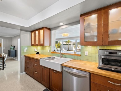 Tucked into one of Dunedin's most sought after on The Dunedin Country Club in Florida - for sale on GolfHomes.com, golf home, golf lot