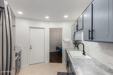 Absolutely immaculate & move in ready! North/South Street facing on Sun City Lakes West and East in Arizona - for sale on GolfHomes.com, golf home, golf lot