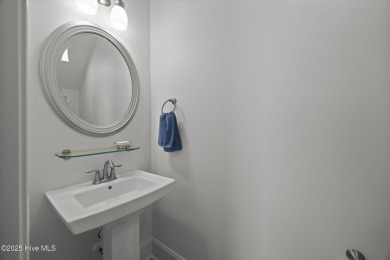 Welcome to 2312 Caracara Drive -- Where Comfort Meets Coastal on Harbour Point Golf Club in North Carolina - for sale on GolfHomes.com, golf home, golf lot