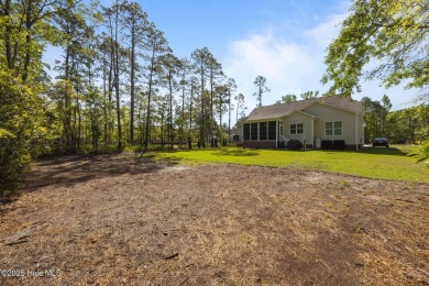 Welcome to 2312 Caracara Drive -- Where Comfort Meets Coastal on Harbour Point Golf Club in North Carolina - for sale on GolfHomes.com, golf home, golf lot