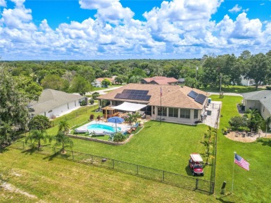 Welcome to this exceptional custom-built Alexander home on Oak Hills Country Club in Florida - for sale on GolfHomes.com, golf home, golf lot