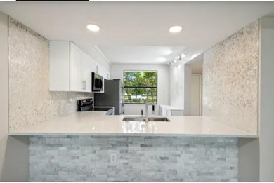 Gorgeous updated large 2 BR/ 2Ba first floor unit with beautiful on Bear Lakes Country Club in Florida - for sale on GolfHomes.com, golf home, golf lot