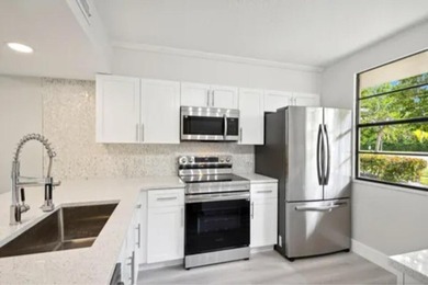 Gorgeous updated large 2 BR/ 2Ba first floor unit with beautiful on Bear Lakes Country Club in Florida - for sale on GolfHomes.com, golf home, golf lot