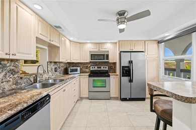 Spacious 2-bedroom, 2-bathroom top-floor condo overlooking a on  in Florida - for sale on GolfHomes.com, golf home, golf lot