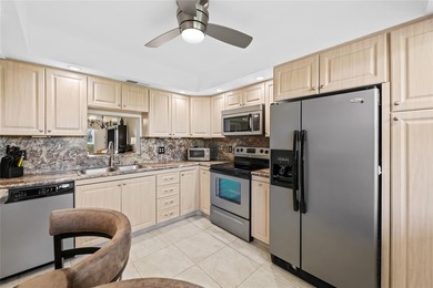 Spacious 2-bedroom, 2-bathroom top-floor condo overlooking a on  in Florida - for sale on GolfHomes.com, golf home, golf lot