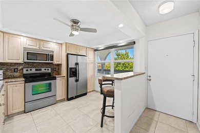 Spacious 2-bedroom, 2-bathroom top-floor condo overlooking a on  in Florida - for sale on GolfHomes.com, golf home, golf lot