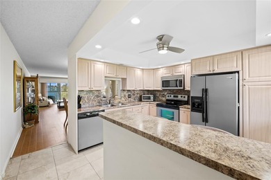 Spacious 2-bedroom, 2-bathroom top-floor condo overlooking a on  in Florida - for sale on GolfHomes.com, golf home, golf lot