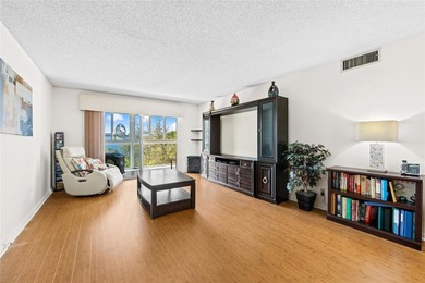 Spacious 2-bedroom, 2-bathroom top-floor condo overlooking a on  in Florida - for sale on GolfHomes.com, golf home, golf lot