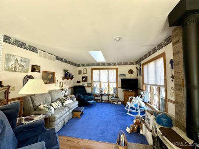 Step into a realm of timeless charm with this beautiful on Escanaba Country Club in Michigan - for sale on GolfHomes.com, golf home, golf lot