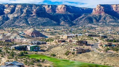 Situated within the prestigious Redlands Mesa golf community on The Golf Club At Redlands Mesa in Colorado - for sale on GolfHomes.com, golf home, golf lot
