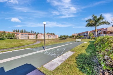 Stunning 1-bedroom, 1.5-bathroom ground-floor unit with a on Sunrise Lakes Phase III in Florida - for sale on GolfHomes.com, golf home, golf lot