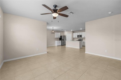 Welcome to this beautifully maintained 4-bedroom, 2-bathroom on Deep Creek Golf Club in Florida - for sale on GolfHomes.com, golf home, golf lot