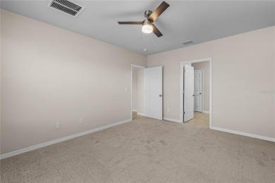 Welcome to this beautifully maintained 4-bedroom, 2-bathroom on Deep Creek Golf Club in Florida - for sale on GolfHomes.com, golf home, golf lot