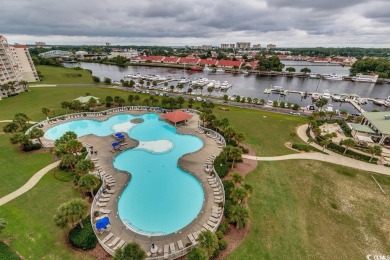 Come view this beautifully decorated TOP FLOOR furnished on Barefoot Resort and Golf Club - Norman Course in South Carolina - for sale on GolfHomes.com, golf home, golf lot