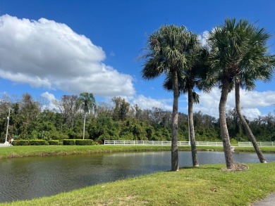 Just beyond the gates of Hidden Golf Club is a perfectly on Lake Henry Golf Club in Florida - for sale on GolfHomes.com, golf home, golf lot