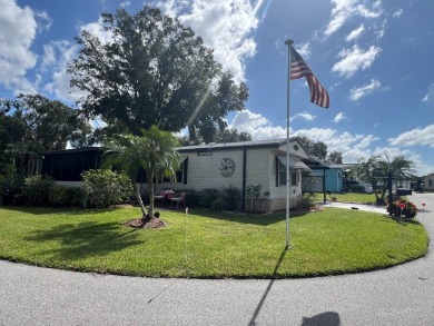 Just beyond the gates of Hidden Golf Club is a perfectly on Lake Henry Golf Club in Florida - for sale on GolfHomes.com, golf home, golf lot