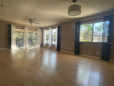 Spacious 3 bedroom, 2 bath split plan condo in a desirable on East Bay Golf Club in Florida - for sale on GolfHomes.com, golf home, golf lot