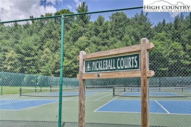 A wooded lot on a quiet street with utilities available on Land Harbor Golf Course in North Carolina - for sale on GolfHomes.com, golf home, golf lot