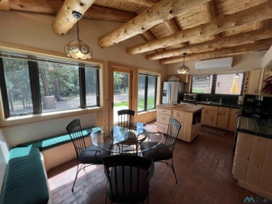 Wake up to fresh mountain air, peaceful pines, and the beauty of on Pendaries Village Community Assoc. in New Mexico - for sale on GolfHomes.com, golf home, golf lot