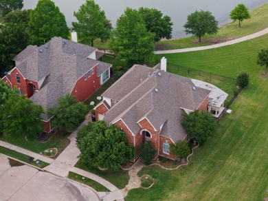 Amazing waterfront home in the exclusive gated community of on Heritage Lakes - Par 3 - 9 Hole Course in Texas - for sale on GolfHomes.com, golf home, golf lot