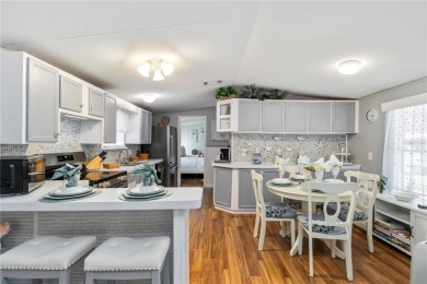 Step into a world of sun-drenched sophistication and carefree on Twin Isles Country Club in Florida - for sale on GolfHomes.com, golf home, golf lot