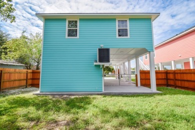 The home is elevated on pilings to allow for covered parking and on Rockport Country Club in Texas - for sale on GolfHomes.com, golf home, golf lot