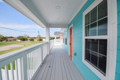 The home is elevated on pilings to allow for covered parking and on Rockport Country Club in Texas - for sale on GolfHomes.com, golf home, golf lot