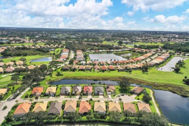 ENJOY THE CASUAL COASTAL LIFESTYLE YOU DESERVE IN PRIVATE, GATED on Pelican Pointe Golf and Country Club in Florida - for sale on GolfHomes.com, golf home, golf lot