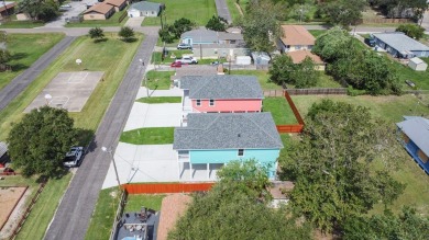 The home is elevated on pilings to allow for covered parking and on Rockport Country Club in Texas - for sale on GolfHomes.com, golf home, golf lot