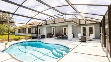 Welcome to this STUNNING POOL HOME situated on the 10th hole of on Arlington Ridge Golf Club in Florida - for sale on GolfHomes.com, golf home, golf lot