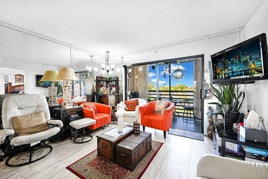 Welcome to this unique 2-bedroom, 2-bathroom corner unit on the on Sunrise Lakes Phase IV Golf Course in Florida - for sale on GolfHomes.com, golf home, golf lot