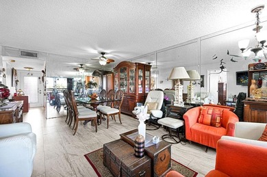 Welcome to this unique 2-bedroom, 2-bathroom corner unit on the on Sunrise Lakes Phase IV Golf Course in Florida - for sale on GolfHomes.com, golf home, golf lot