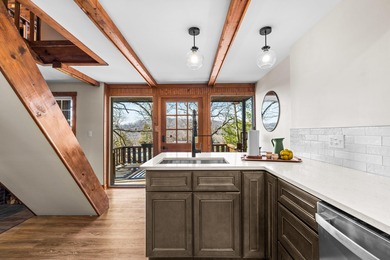 Tucked into a prime hillside setting within Hide-A-Way Hills on Hide-A-Way Hills Golf Club in Ohio - for sale on GolfHomes.com, golf home, golf lot