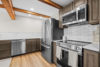 Tucked into a prime hillside setting within Hide-A-Way Hills on Hide-A-Way Hills Golf Club in Ohio - for sale on GolfHomes.com, golf home, golf lot