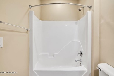 This home has it all! Curb appeal, low maintenance, attention to on Cape Fear National At Brunswick Forest in North Carolina - for sale on GolfHomes.com, golf home, golf lot