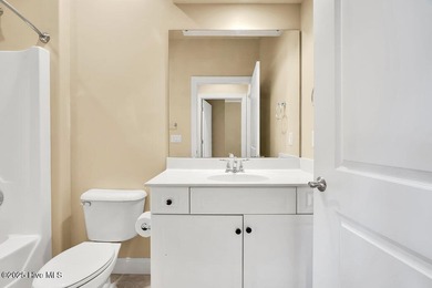 This home has it all! Curb appeal, low maintenance, attention to on Cape Fear National At Brunswick Forest in North Carolina - for sale on GolfHomes.com, golf home, golf lot