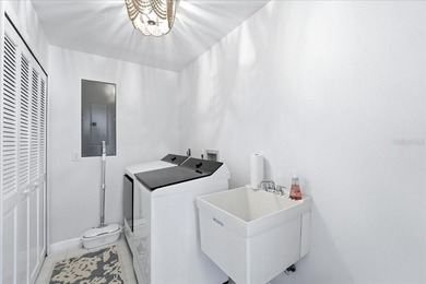 Move-in ready coastal home with extensive high-value upgrades on Rotonda Golf and Country Club The Links Course in Florida - for sale on GolfHomes.com, golf home, golf lot