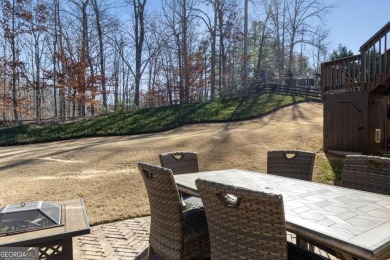 Welcome to your completely renovated haven in coveted Woodmont on Woodmont Golf and Country Club in Georgia - for sale on GolfHomes.com, golf home, golf lot