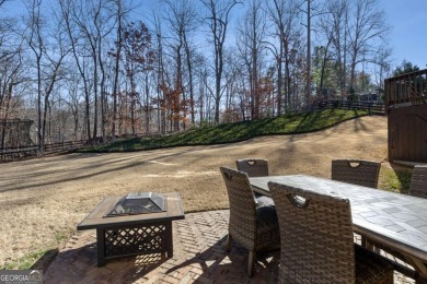 Welcome to your completely renovated haven in coveted Woodmont on Woodmont Golf and Country Club in Georgia - for sale on GolfHomes.com, golf home, golf lot