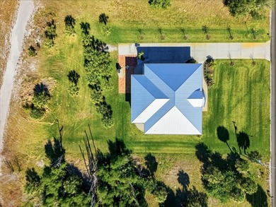 Move-in ready coastal home with extensive high-value upgrades on Rotonda Golf and Country Club The Links Course in Florida - for sale on GolfHomes.com, golf home, golf lot