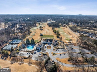 Welcome to your completely renovated haven in coveted Woodmont on Woodmont Golf and Country Club in Georgia - for sale on GolfHomes.com, golf home, golf lot