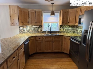 Beautifully situated home on corner of Linville Land Harbor on Land Harbor Golf Course in North Carolina - for sale on GolfHomes.com, golf home, golf lot