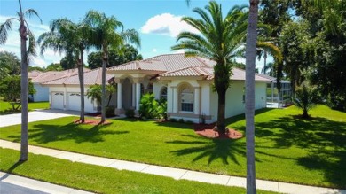 PARADISE Awaits in this SPECTACULAR WATERFRONT Home Located in on Crescent Oaks Country Club in Florida - for sale on GolfHomes.com, golf home, golf lot