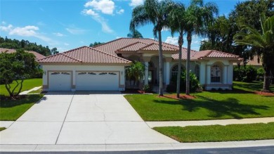 PARADISE Awaits in this SPECTACULAR WATERFRONT Home Located in on Crescent Oaks Country Club in Florida - for sale on GolfHomes.com, golf home, golf lot