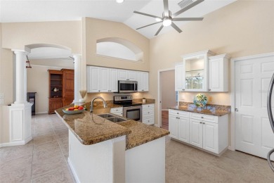 Nestled in a highly sought-after executive golf course community on Pinemoor West Golf Club in Florida - for sale on GolfHomes.com, golf home, golf lot