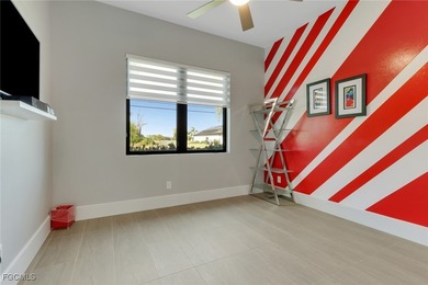 Discover modern coastal living in this Beautiful custom Home on Burnt Store Golf Club in Florida - for sale on GolfHomes.com, golf home, golf lot